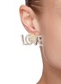 模特儿示范图 - 点击放大 - VENNA - 仿水晶点缀NO LOVE造型金属耳环