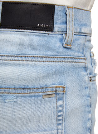  - AMIRI - 磨破设计堆叠裤脚修身牛仔裤