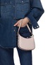 模特儿示范图 - 点击放大 - VALENTINO GARAVANI - Mini Rockstud Hobo Calfskin Bag
