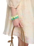 模特儿示范图 - 点击放大 - SCRUNCHIE IS BACK ACCESSORIES - BICHOUS® Pearly Woven Fabric Scrunchie — Small